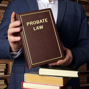 A person holding a book titled 'Probate Law symbolizing probate process