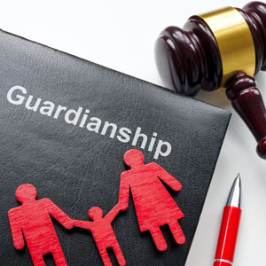 Concept of guardianship with a gavel and family cutouts symbolizing the role of a guardian