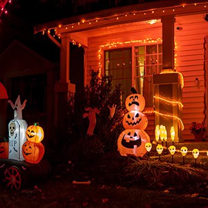 A house decorated with glowing Halloween pumpkins and lights, illustrating a potential Premises Liability injury case
